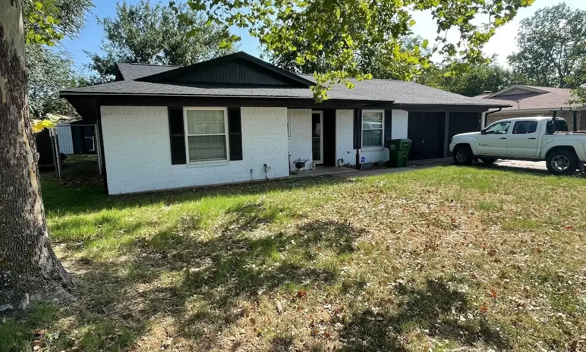 Professional roofing crew working on a residential roof in South St. Paul